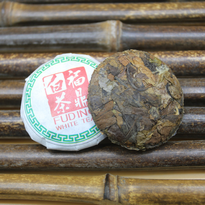 Fuding white tea 2019 sun-dried gold coin small button small tea cake 500g aged alpine jujube tea